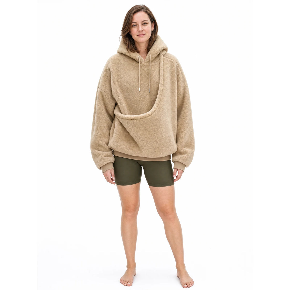 Full length view of the khaki Puppy Pouch Hoodie showing the oversized fit and the carrier opening