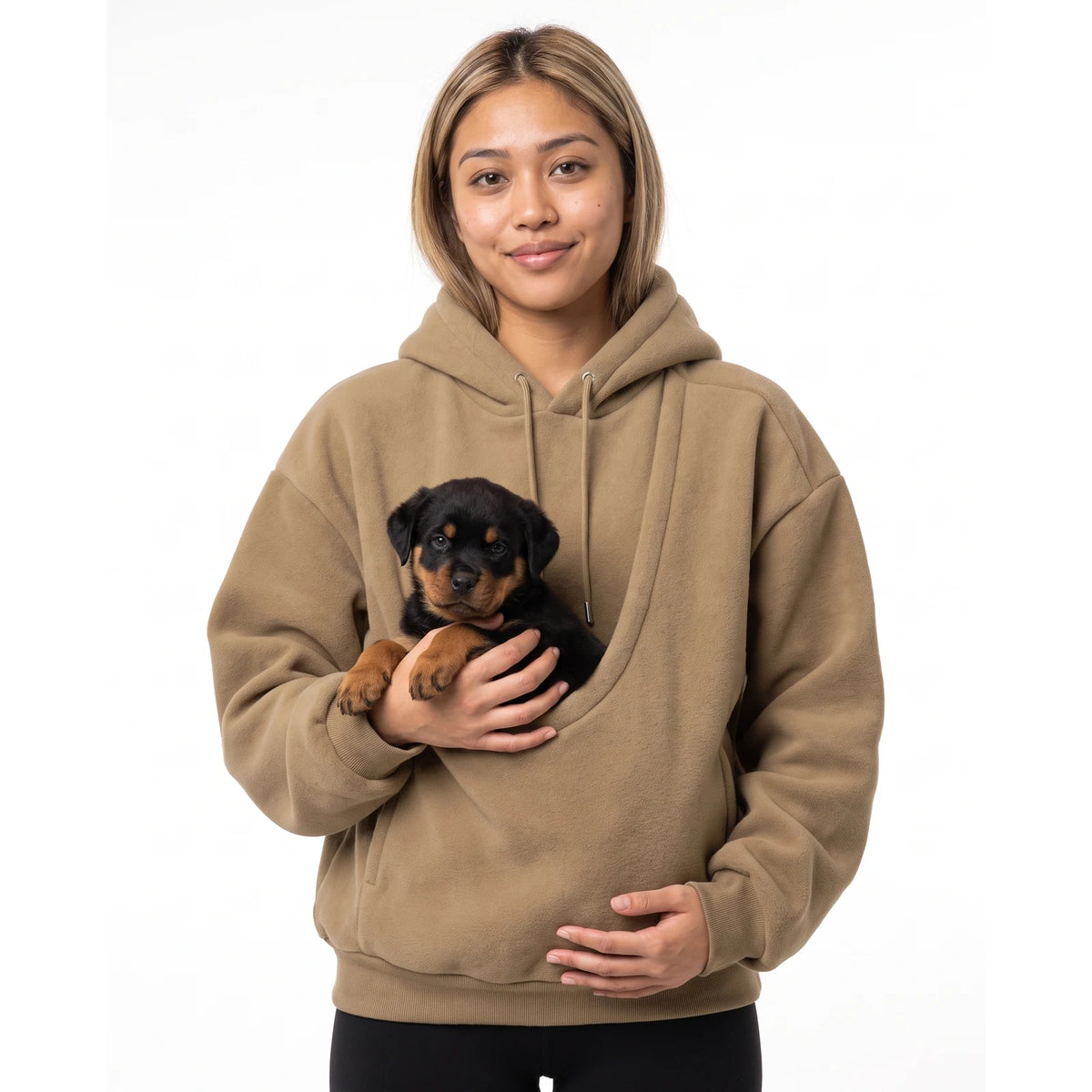 Woman wearing the khaki Puppy Pouch Hoodie with a Rottweiler puppy in the front carrier opening