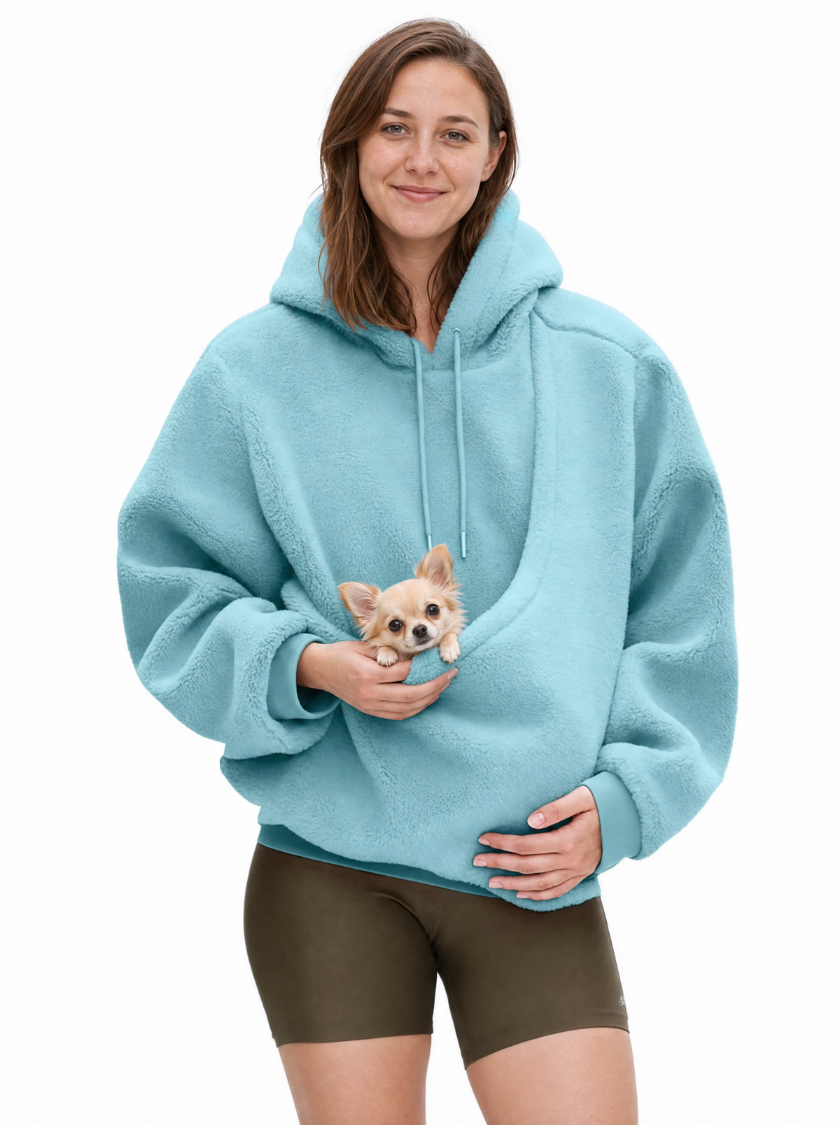 Woman wearing the sky blue Puppy Pouch Hoodie with a chihuahua puppy in the front carrier opening