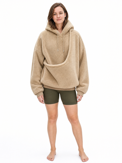 Full length view of the khaki Puppy Pouch Hoodie showing the oversized fit and the empty carrier opening